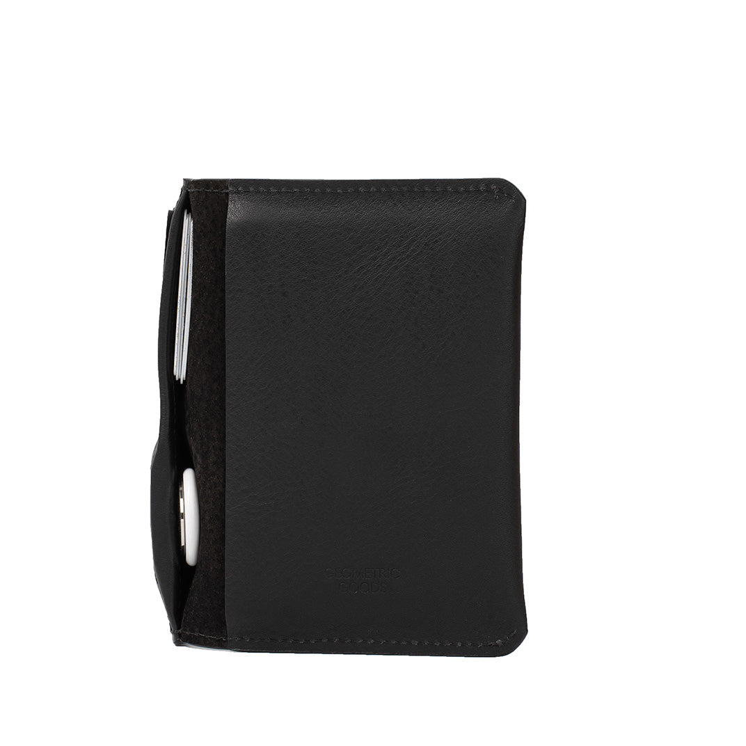 Black full-grain Italian leather passport holder with RFID-blocking pocket and hidden AirTag slot