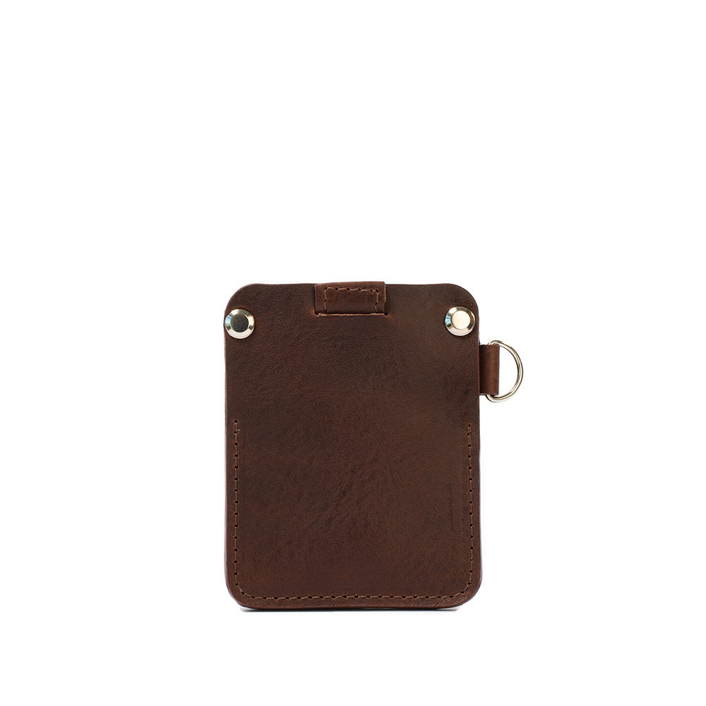 Compact brown leather AirTag wallet with D-ring and hidden AirTag pocket for cards.