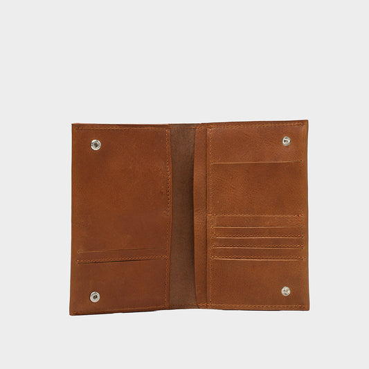 Brown Italian leather AirTag wallet with multiple card slots and snap closures, handcrafted in Europe