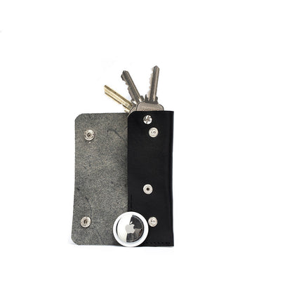 Black leather AirTag key case 3.0 with hidden AirTag pocket and keys inside