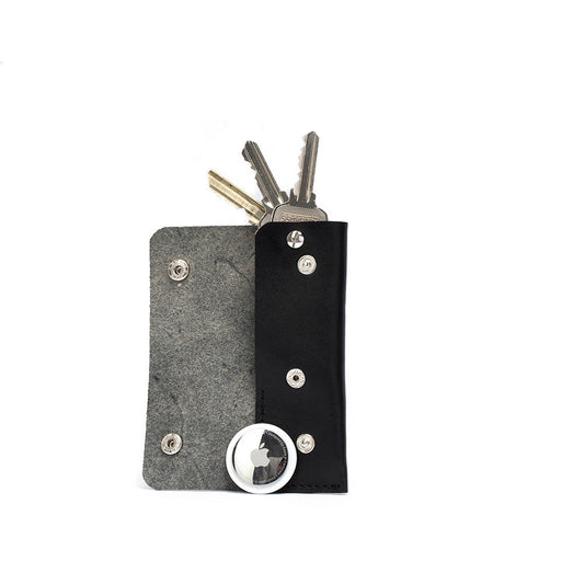Black leather AirTag key case 3.0 with hidden AirTag pocket and keys inside