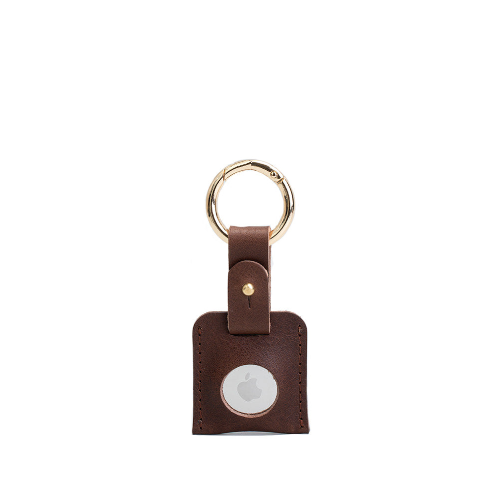 Brown leather AirTag keychain with gold circle carabiner handcrafted from premium Italian leather