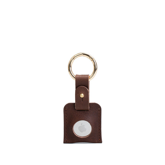 Brown leather AirTag keychain with gold circle carabiner handcrafted from premium Italian leather