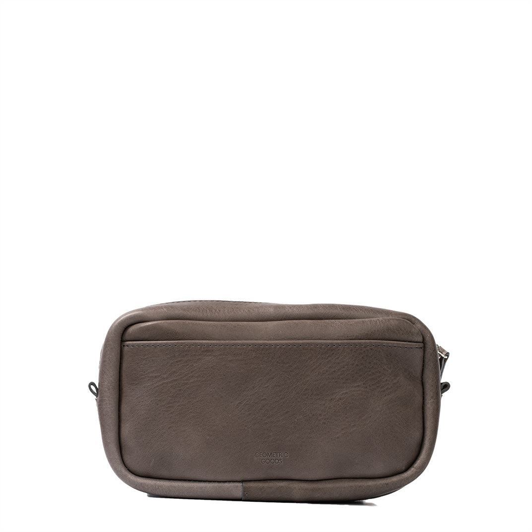 Gray full-grain Italian leather Mini Messenger bag with minimalist design and adjustable strap
