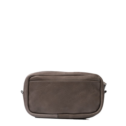 Gray full-grain Italian leather Mini Messenger bag with minimalist design and adjustable strap