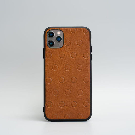 Brown leather iPhone 11 case with embossed polka dots and black TPU bumper for protection