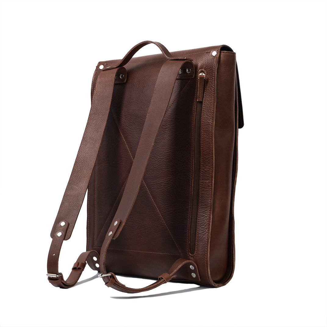 Mahogany leather laptop backpack with adjustable straps and sleek minimalist design