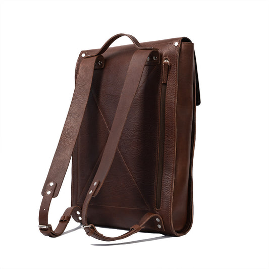 Mahogany leather laptop backpack with adjustable straps and sleek minimalist design