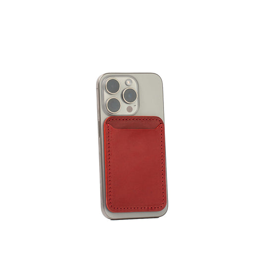 Top-grain leather MagSafe wallet in red attached to a silver iPhone, holds 2-3 cards, compatible with Apple and other MagSafe cases