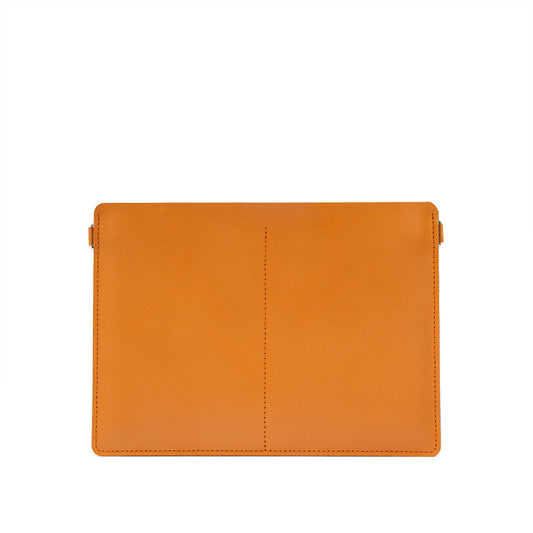 Minimalist tan leather bag designed for iPad with smooth vegetable-tanned Italian leather and precise stitching.