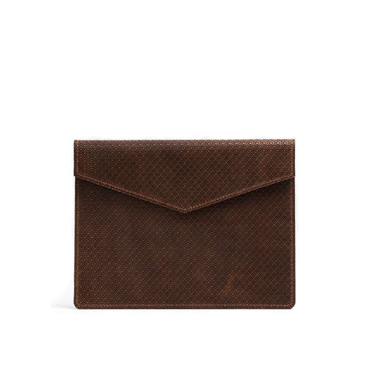 Brown geometric embossed leather sleeve for MacBook with envelope-style flap