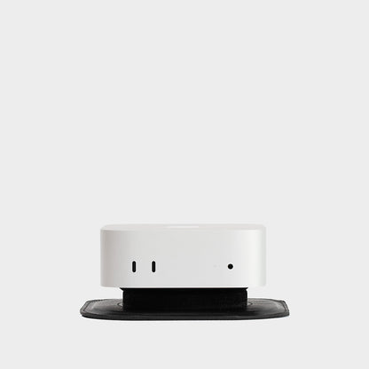 Minimalist Mac Mini Stand made from premium Italian full-grain leather, designed for improved airflow and modern desk setups.