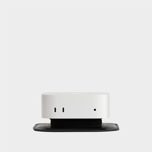 Minimalist Mac Mini Stand made from premium Italian full-grain leather, designed for improved airflow and modern desk setups.