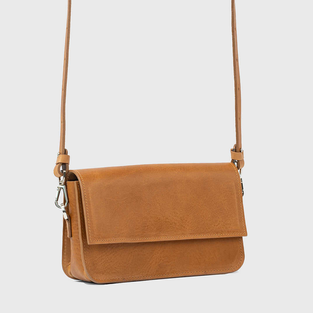 Camel leather shoulder bag with adjustable strap and sleek design