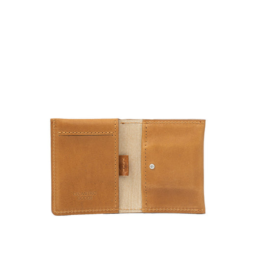 Minimalist tan leather AirTag card holder wallet with quick card access and hidden AirTag pocket