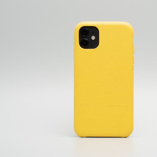Yellow leather iPhone 11 case with minimalist handcarved Drops pattern and full protective cover design